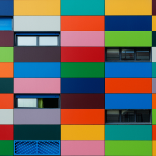 A colorful building with windows and doors.