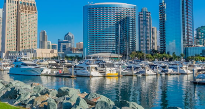 San diego, california skyline with boats docked in the harbor.