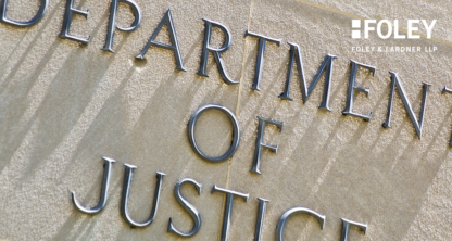 Close-up view of the words "Department of Justice" engraved on a stone wall, with the Foley & Lardner LLP logo in the upper right corner, highlighting their reputation as a leading corporate law office.