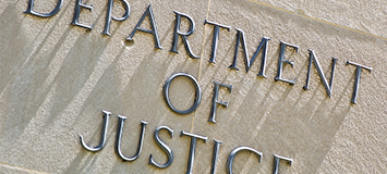 The words "Department of Justice" engraved on a stone wall—a symbol recognized by Chicago lawyers and law offices specializing in intellectual property law.