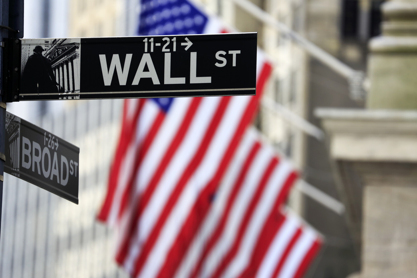 A street sign with a flag in the background, located near renowned law offices, capturing the professional atmosphere of lawyers in Chicago.