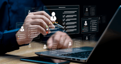 A person interacts with digital resume profiles displayed as holograms above a laptop, suggesting concepts of online recruitment or candidate selection.