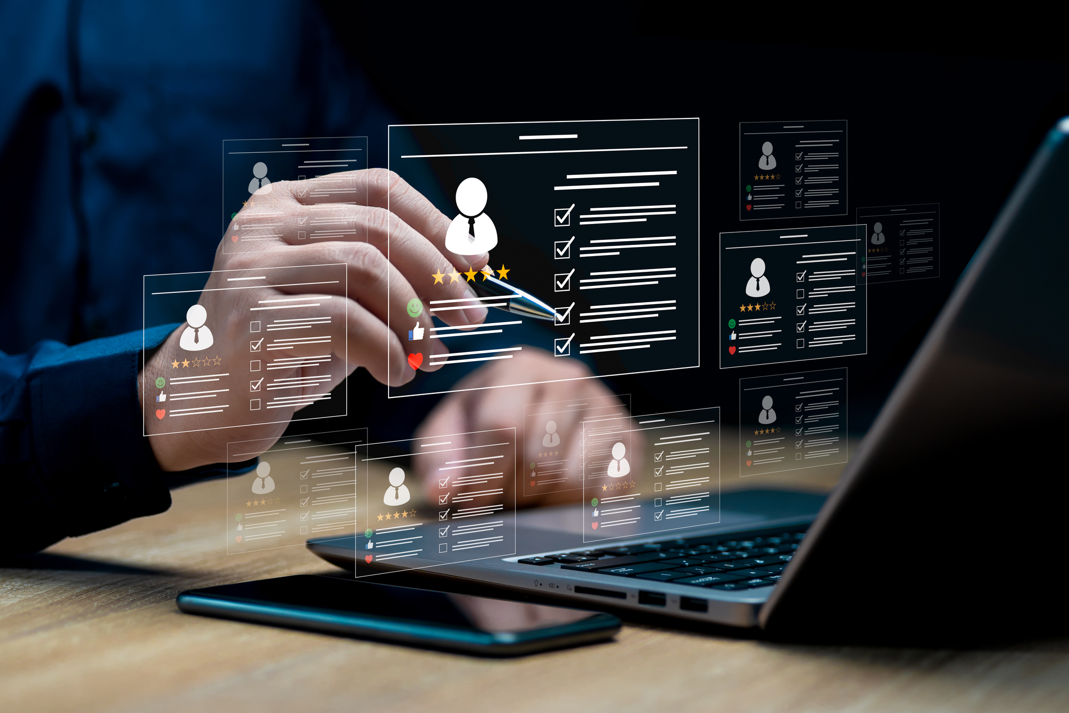 A person interacts with digital resume profiles displayed as holograms above a laptop, suggesting concepts of online recruitment or candidate selection.