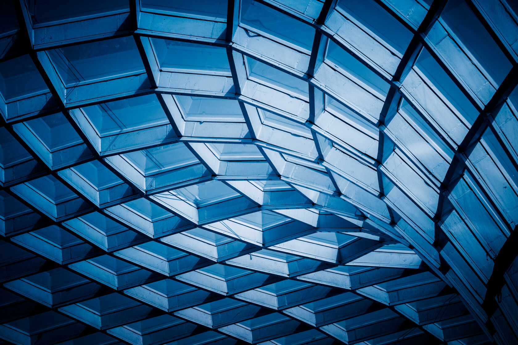 Close-up of a contemporary glass building with geometric patterns.