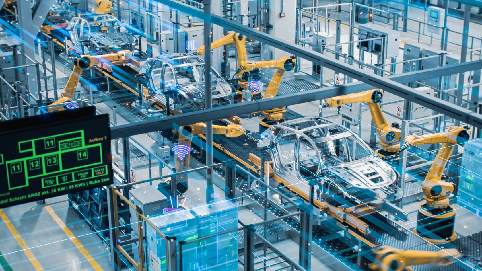 Robotic arms assembling cars in an advanced manufacturing plant.